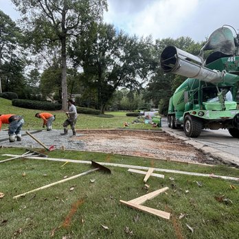 Arbor Hills Construction - Leveling fresh concrete at the base of our driveway - Masonry/Concrete Near Me Arbor Hills Construction - Leveling fresh concrete at the base of our driveway - Masonry/Concrete Near Me