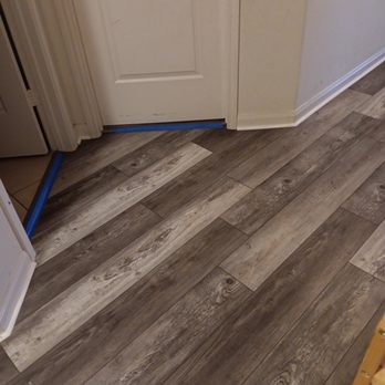 Ava’s Remodeling  -  a wood floor in a kitchen - Flooring Near Me