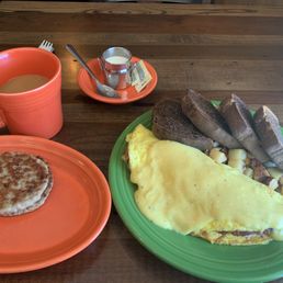 Corned beef omelette, breakfast potatoes, rye bread, sausage and coffee Corned beef omelette, breakfast potatoes, rye bread, sausage and coffee