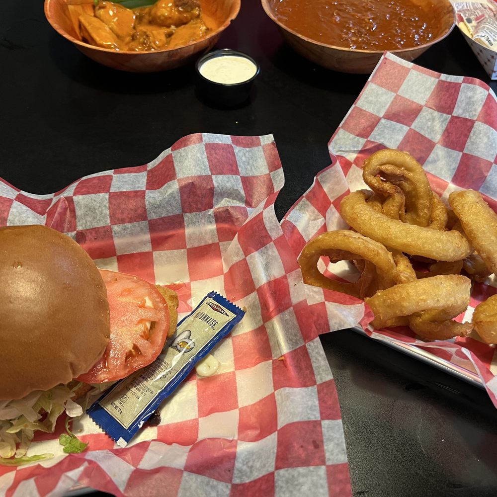 Wings Bar & Grill - Fish Sandwich and side of Onion Rings - Bars Near Me - Batavia, Ohio Wings Bar & Grill - Fish Sandwich and side of Onion Rings - Bars Near Me - Batavia, Ohio