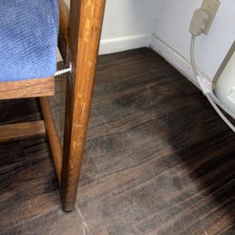 Broken chair with screw sticking out Broken chair with screw sticking out