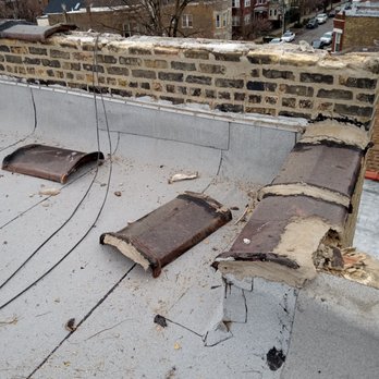 Capital Roofing Construction - Copings that Capital had attached less that 2 years prior, just flying off the parapet walls like they were attached with glitter glue - Roofing Near Me Capital Roofing Construction - Copings that Capital had attached less that 2 years prior, just flying off the parapet walls like they were attached with glitter glue - Roofing Near Me