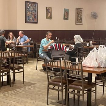 Hilal Grill - people sitting at tables in a restaurant - Indian Near Me - Phoenix, Arizona