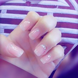 Beautiful nails done by one of the amazing young ladies here! She recommended the extra sparkles on the ring finger Beautiful nails done by one of the amazing young ladies here! She recommended the extra sparkles on the ring finger