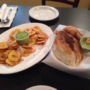 Photo of Geo's Cuban & Creole Cafe - Seattle, WA, United States. Mariquitas de Platános with a side of Cuban bread.