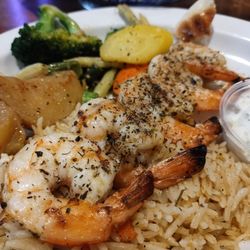 Greek Islands Restaurants - Shrimp souvlaki lunch portion with veggies, potatoes, rice, pita and tzatziki sauce.