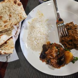 Herbal garlic naan, basmati rice, palak paneer, and aloo bharta