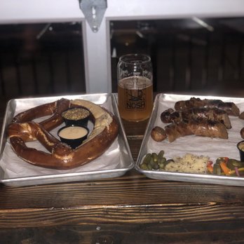 West Oak Nosh - Best Pretzel  Ever !! The little pickled sides are so good !! And the Sausages were cooked just right and great flavor - German Near Me - Lodi, California