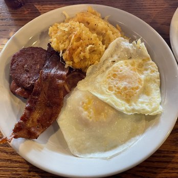 Cracker Barrel Old Country Store - Two over easy eggs, hash brown casserole, sausage and bacon. - Breakfast & Brunch Near Me - Norcross, Georgia Cracker Barrel Old Country Store - Two over easy eggs, hash brown casserole, sausage and bacon. - Breakfast & Brunch Near Me - Norcross, Georgia