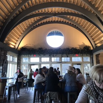 Heron Hill Winery - a large group of people sitting at tables - Wineries Near Me - Hammondsport, New York