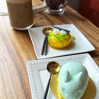 The Spoon - Lychee mousse (rabbit) and mango passion cheesecake Vietnamese coffee (left) and ube cafe latte (right) - Desserts Near Me - Stanton, California The Spoon - Lychee mousse (rabbit) and mango passion cheesecake Vietnamese coffee (left) and ube cafe latte (right) - Desserts Near Me - Stanton, California