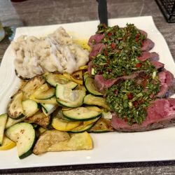 Chimichurri steak with mashed potatoes & vegetables.