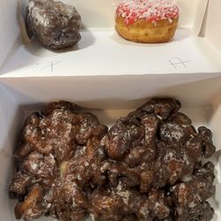Blueberry cake, peach/apple fritter and a cherry coconut donut.