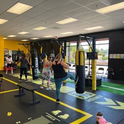 Level 12 Family Gym - Kick and/or punch combinations on the heavy bags. That is level 12 as seen on the ground. Tire flips were level 2 that day.