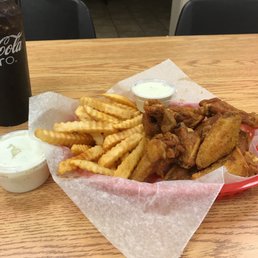 a basket of fried chicken and fries a basket of fried chicken and fries
