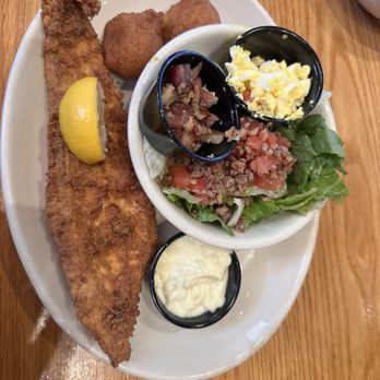 The Boundary House Restaurant - Luncheon flounder, side, boundary salad with ham and eggs on the side. Comes with two hush puppies. - American Near Me - Calabash, North Carolina The Boundary House Restaurant - Luncheon flounder, side, boundary salad with ham and eggs on the side. Comes with two hush puppies. - American Near Me - Calabash, North Carolina