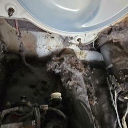 Burnt lint inside the dryer cabin