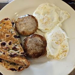 Minnesota Nice Cafe - Lumbar Jill breakfast. Eggs, sausage & cranberry wild rice toast. Very good & just right sized with coffee.