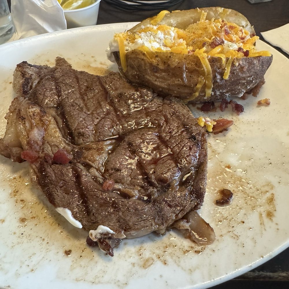 Aspen Creek Grill - 12 ounce ribeye with a loaded baked potato - Seafood Near Me - Amarillo, Texas