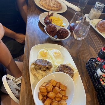 Another Broken Egg Cafe - Biscuit & Gravy platter & waffles with the hash brown balls - Breakfast & Brunch Near Me - Austin, Texas