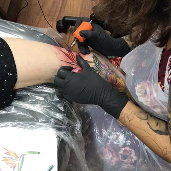 Skin Design Tattoo - Honolulu - Lynn laying down that pink and red color! - Tattoo Near Me - Honolulu, Hawaii