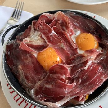 Cafe Murillo - Broken eggs dish. - Mediterranean Near Me - Madrid, M