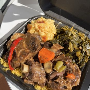 Mangos Cafe And Specialty store - Oxtails over yellow rice with Macaroni & Cheese and Smoked Turkey Collard Greens - Caribbean Near Me - Temple Terrace, Florida Mangos Cafe And Specialty store - Oxtails over yellow rice with Macaroni & Cheese and Smoked Turkey Collard Greens - Caribbean Near Me - Temple Terrace, Florida