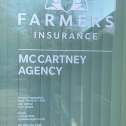 Farmers Insurance - Michael McCartney - Outdoor entrance showing times of operation and contact info.