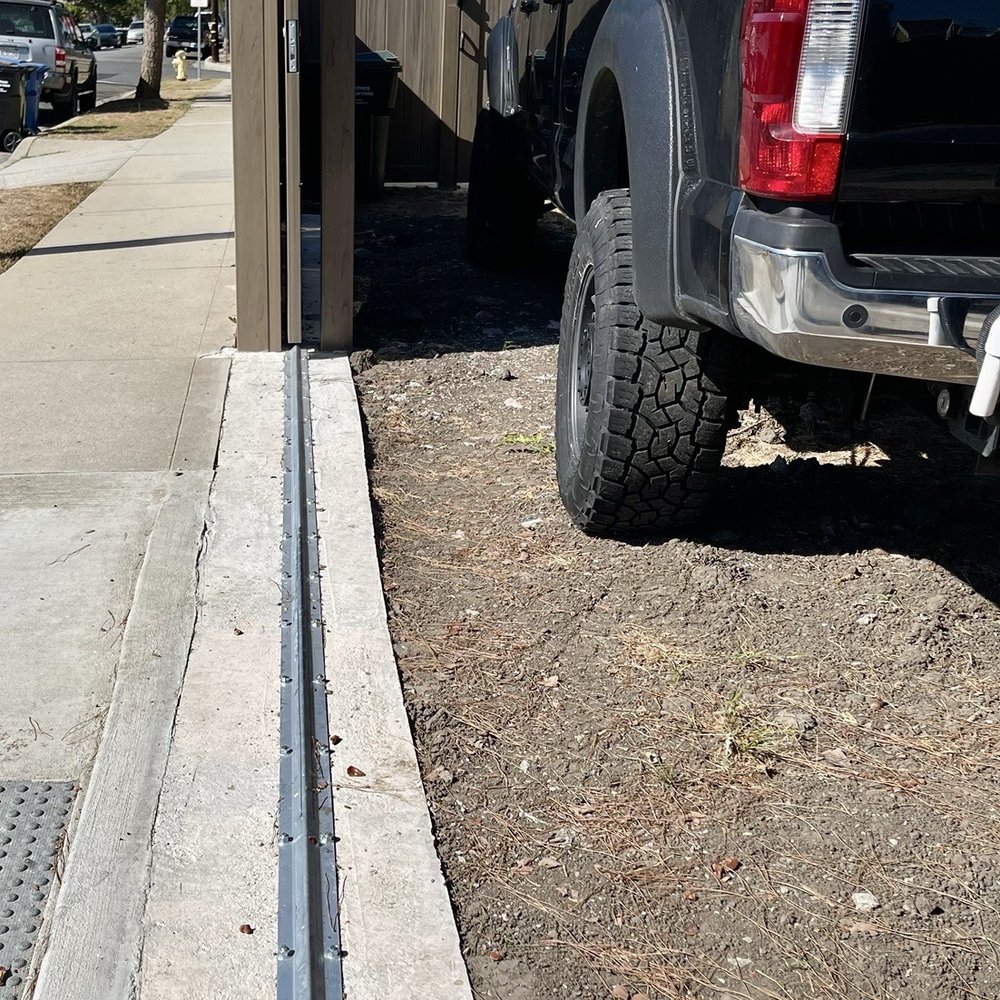Vinyl Concepts - Track for rolling gate with a rebar-reinforced 5000 psi concrete slab. - Fences & Gates Near Me - Torrance, California