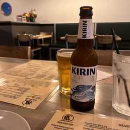 a bottle of beer and a glass of water a bottle of beer and a glass of water