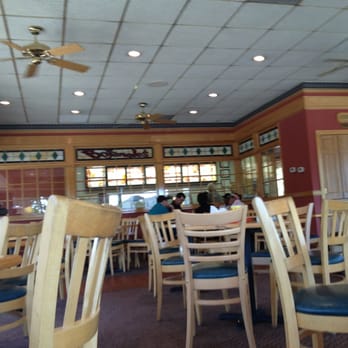 Bojangles - people sitting at tables in a restaurant - Southern Near Me - Raleigh, North Carolina