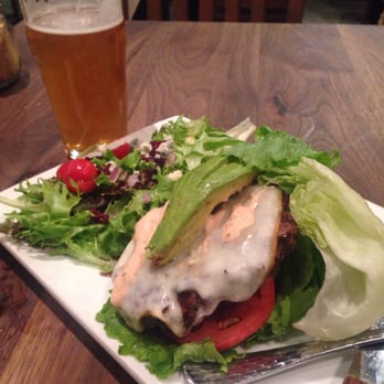 Eureka! - Side house salad, amazing! The lemon dressing brings all of the flavors out & the eureka burger wrapped in lettuce - American Near Me - Santa Barbara, California
