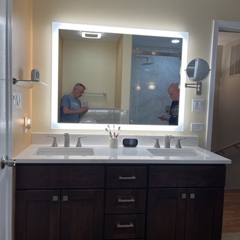 Metro Construction and Remodeling Inc - a man in the mirror - General Contractors Near Me - Chicago, Illinois