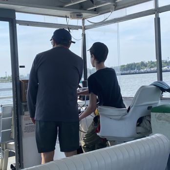 Skimmer Salt Marsh Safari - My 14 year old...driving the boat.  They let the little kids drive too for a few minutes. - Boat Charters Near Me - Cape May, New Jersey