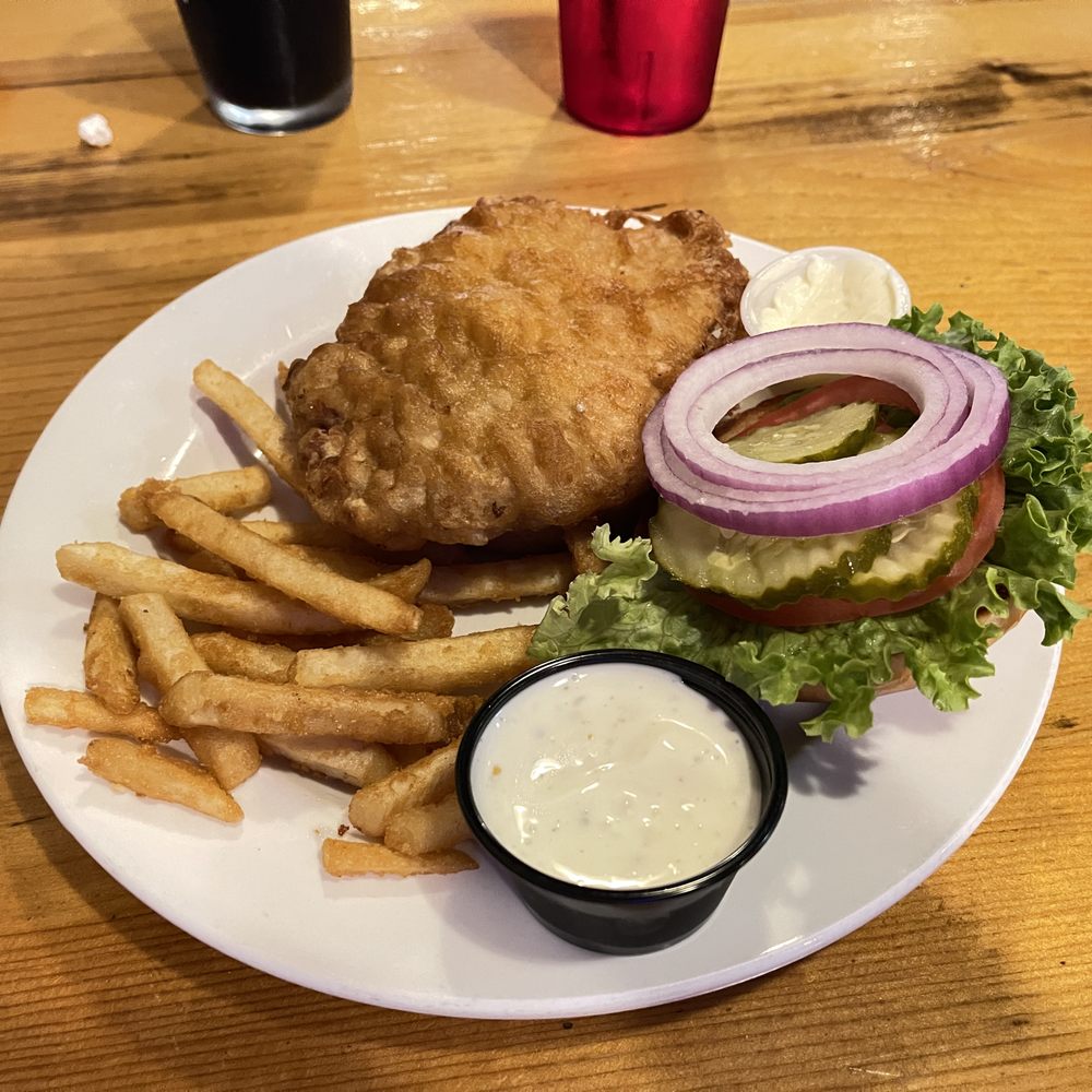 Bookers Bar & Grill - Breaded pork tenderloin with a side of lightly battered fries and a cup of ranch to dip in. - Bars Near Me - Kirklin, Indiana Bookers Bar & Grill - Breaded pork tenderloin with a side of lightly battered fries and a cup of ranch to dip in. - Bars Near Me - Kirklin, Indiana