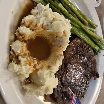 Ted's Montana Grill - Bison ribeye, asparagus, mashed potatoes - American Near Me - Charlotte, North Carolina Ted's Montana Grill - Bison ribeye, asparagus, mashed potatoes - American Near Me - Charlotte, North Carolina