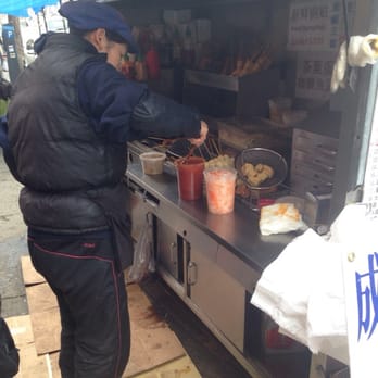 Linda's Mini Kitchen - a man preparing food - Street Vendors Near Me - Brooklyn, New York
