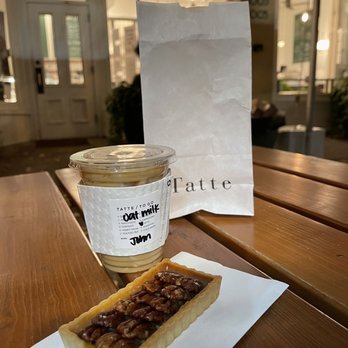 Tatte Bakery & Cafe | Beacon St - Iced oat milk latte, petit pecan bar - Bakeries Near Me - Brookline, Massachusetts Tatte Bakery & Cafe | Beacon St - Iced oat milk latte, petit pecan bar - Bakeries Near Me - Brookline, Massachusetts
