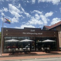 Outside seating area of the front of the store on N College Ave