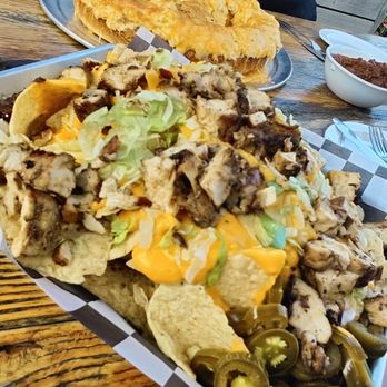 Tiki Lee's Dock Bar - jerk chicken nachos - New American Near Me - Sparrows Point, Maryland