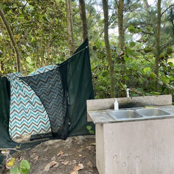 Malaekahana Beach Campground - Showers are behind the curtain yet the back is open to campers in the field. - Campgrounds Near Me - Kahuku, Hawaii Malaekahana Beach Campground - Showers are behind the curtain yet the back is open to campers in the field. - Campgrounds Near Me - Kahuku, Hawaii