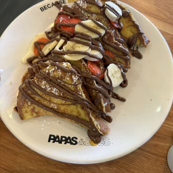 Papas and Eggs - a plate of french toast with bananas and strawberries - Breakfast & Brunch Near Me - San Jose, California