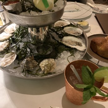 Rare Steakhouse - Delicious local oysters laid out on dry ice, that delicious bread and a mocktail fit for a sober queen. - Steakhouses Near Me - Everett, Massachusetts Rare Steakhouse - Delicious local oysters laid out on dry ice, that delicious bread and a mocktail fit for a sober queen. - Steakhouses Near Me - Everett, Massachusetts