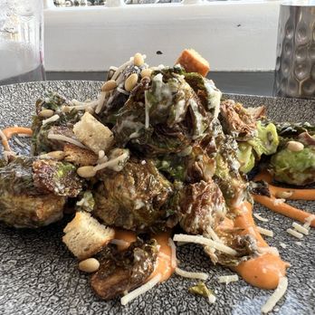 Lamplight Lounge - Brussels Caesar: House-made Dressing, Toasted Pine Nuts and Garlic Croutons with Roasted Red Pepper and Tomato Sauce. - New American Near Me - Anaheim, California
