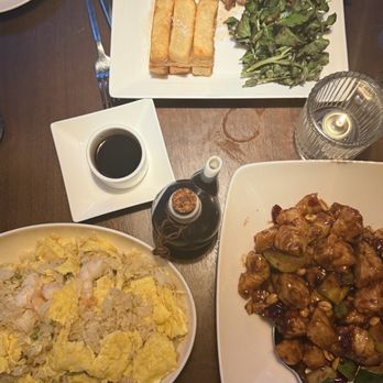Toku Modern Asian - Table Spread of Shrimp Fried Rice, Kung Pao Chicken and Steak with Yucca Fries - Asian Fusion Near Me - Aventura, Florida Toku Modern Asian - Table Spread of Shrimp Fried Rice, Kung Pao Chicken and Steak with Yucca Fries - Asian Fusion Near Me - Aventura, Florida