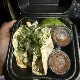 Chicken and fried shrimp taco with red salsa Chicken and fried shrimp taco with red salsa