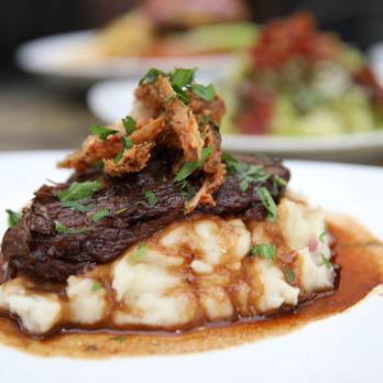 Traxx Restaurant - Braised Beef w/red skin mashed potatoes - New American Near Me - Los Angeles, California Traxx Restaurant - Braised Beef w/red skin mashed potatoes - New American Near Me - Los Angeles, California