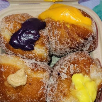 Passion Bakery Cafe - Freshly baked malasadas - clockwise: ube, mango, lilikoi, expresso - Bakeries Near Me - Kapaa, Hawaii