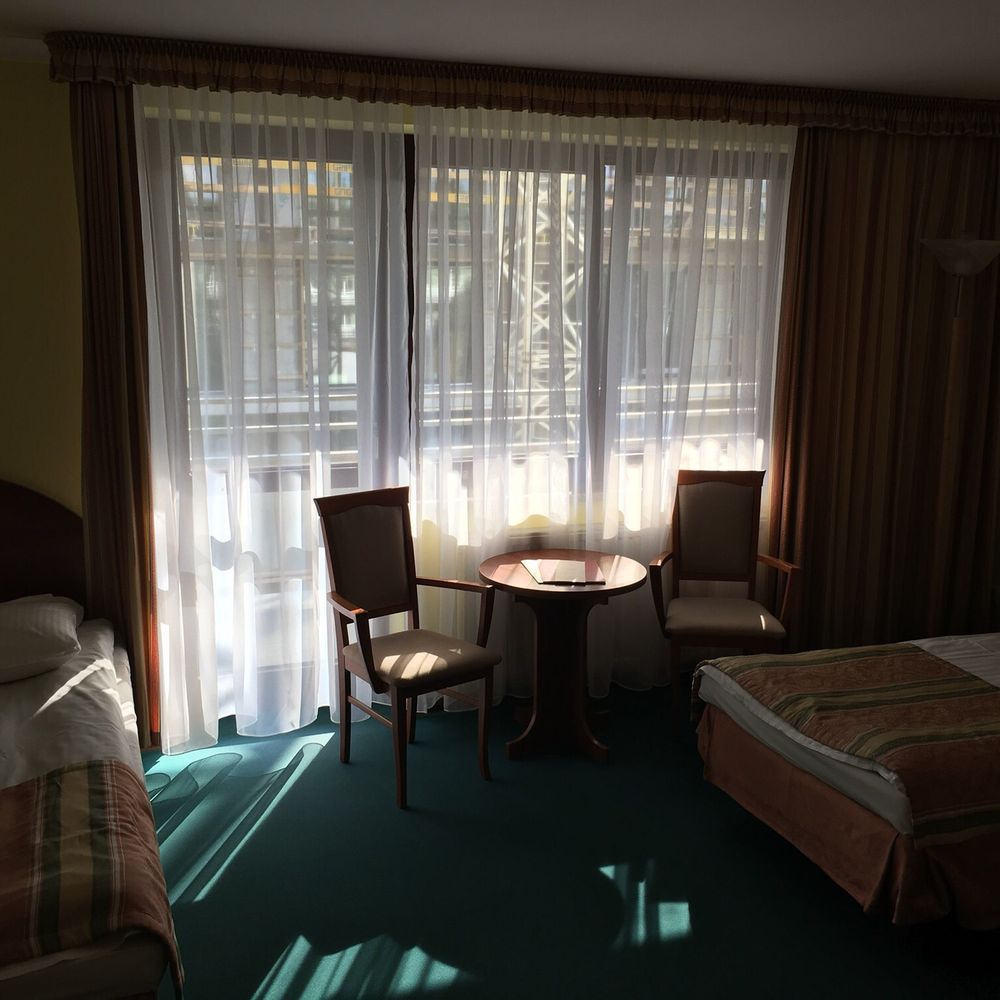 Hotel Wersal - Sitting area and door leads out to very large balcony. - Hotels Near Me - Zakopane, Massachusetts