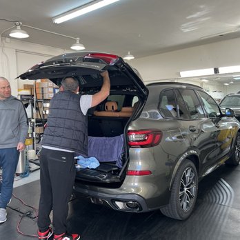 Lion Window Tinting - Levon working efficiently on the back window. - Car Window Tinting Near Me - San Mateo, California Lion Window Tinting - Levon working efficiently on the back window. - Car Window Tinting Near Me - San Mateo, California